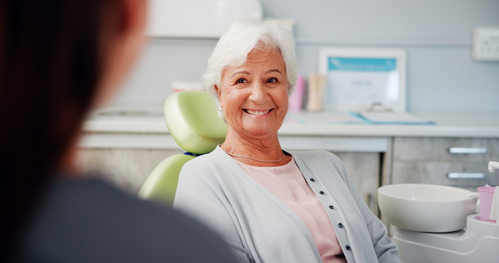 Busy Life? Keep Your Dental Implant Maintenance Quick and Easy 7 Smile, dentist or senior woman in office with dentures, teeth or veneer implant results. Happy, patient or elderly person in appointment with doctor, dental procedure or treatment for oral health